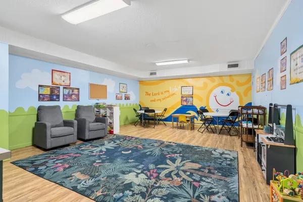 a view of a livingroom with furniture and rug