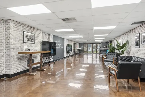 a view of a livingroom with furniture and a flat screen tv