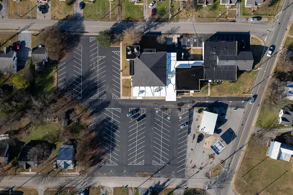 a front view of a house with parking