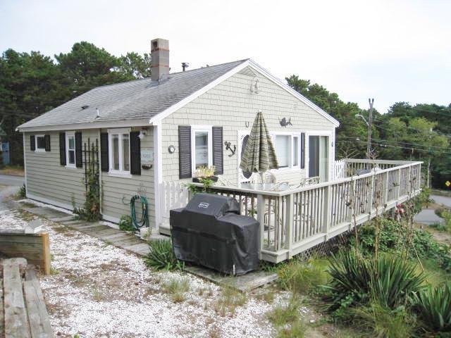 130 Pleasant Point Road Wellfleet, MA 02667 - Photo 7 of 20 a view of a house with wooden fence