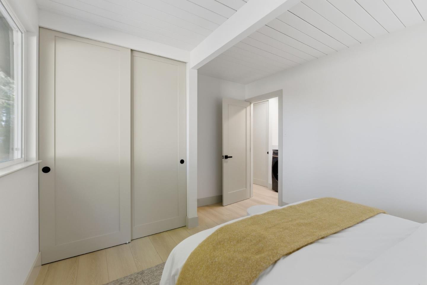 2212 Juniperberry Drive San Rafael, CA 94903 - Photo 34 of 81 a bedroom with a bed and a mirror