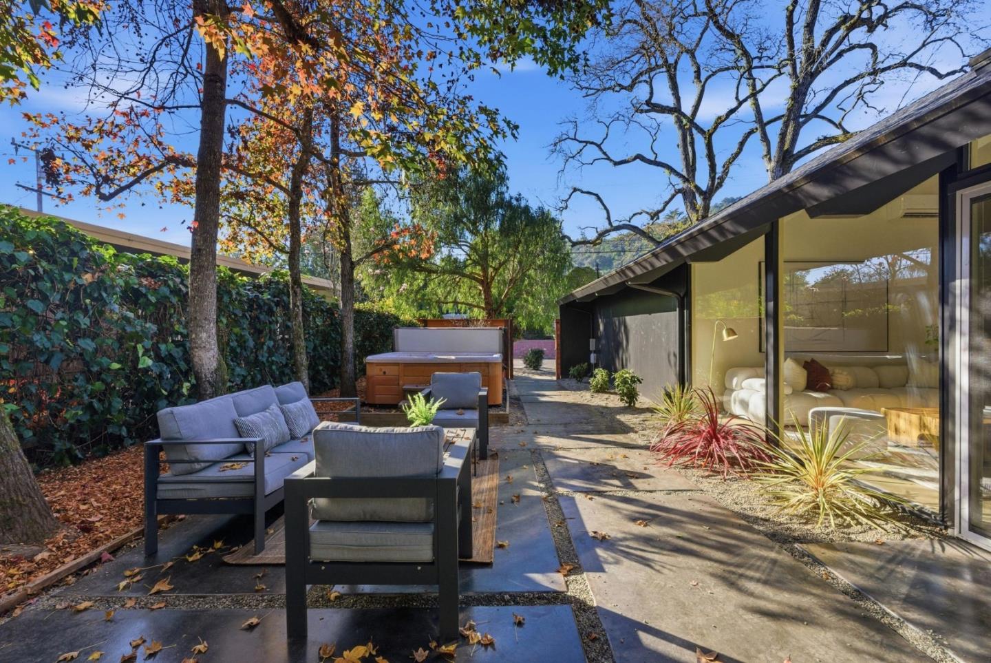 2212 Juniperberry Drive San Rafael, CA 94903 - Photo 41 of 81 a view of a patio with table and chairs and floor to ceiling window