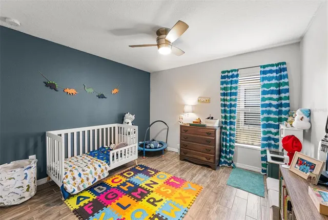 a bedroom with furniture and a window