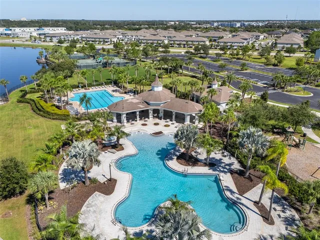 an aerial view of a house with a lake view
