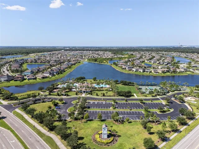 an aerial view of a residential houses with outdoor space