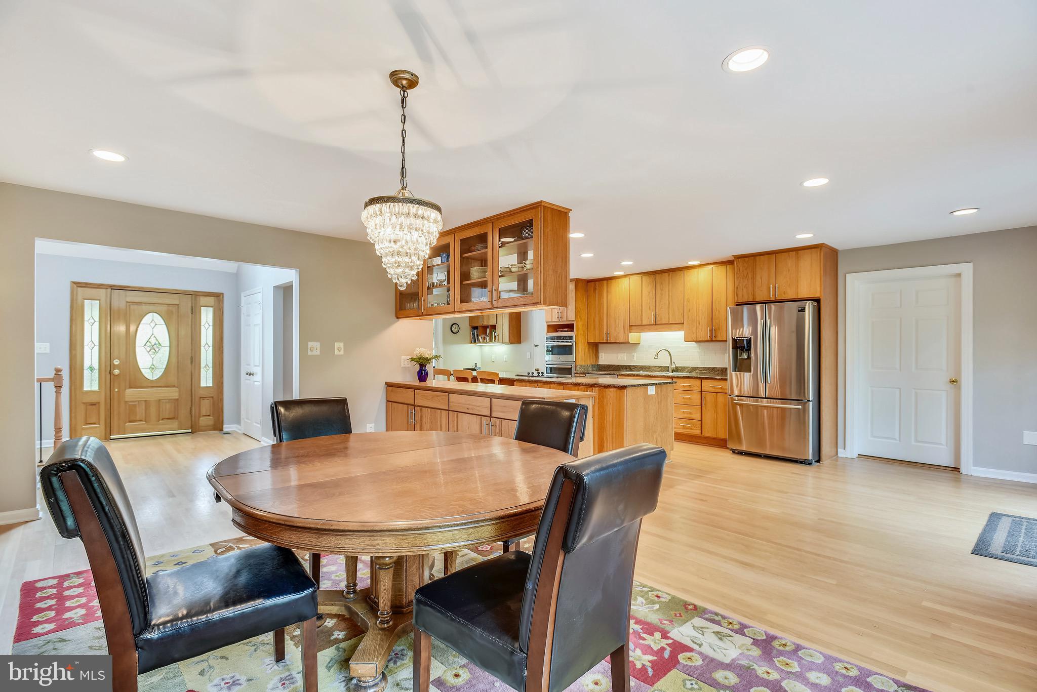 11727 Quay Road Oakton, VA 22124 - Photo 12 of 47 Dining room opens to kitchen. Hardwood floors!
