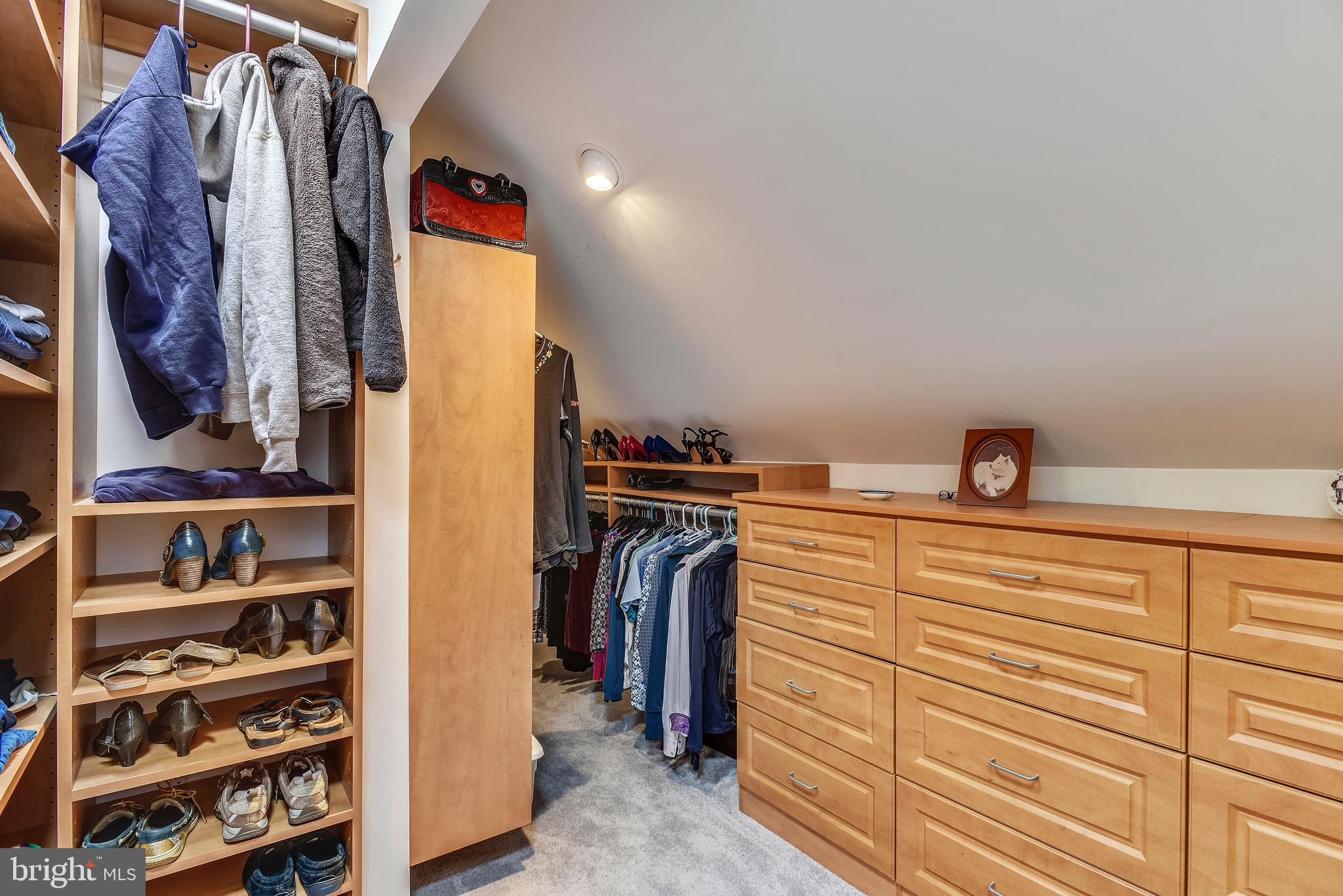 11727 Quay Road Oakton, VA 22124 - Photo 23 of 47 Master bedroom walk-in closet with custom shelving