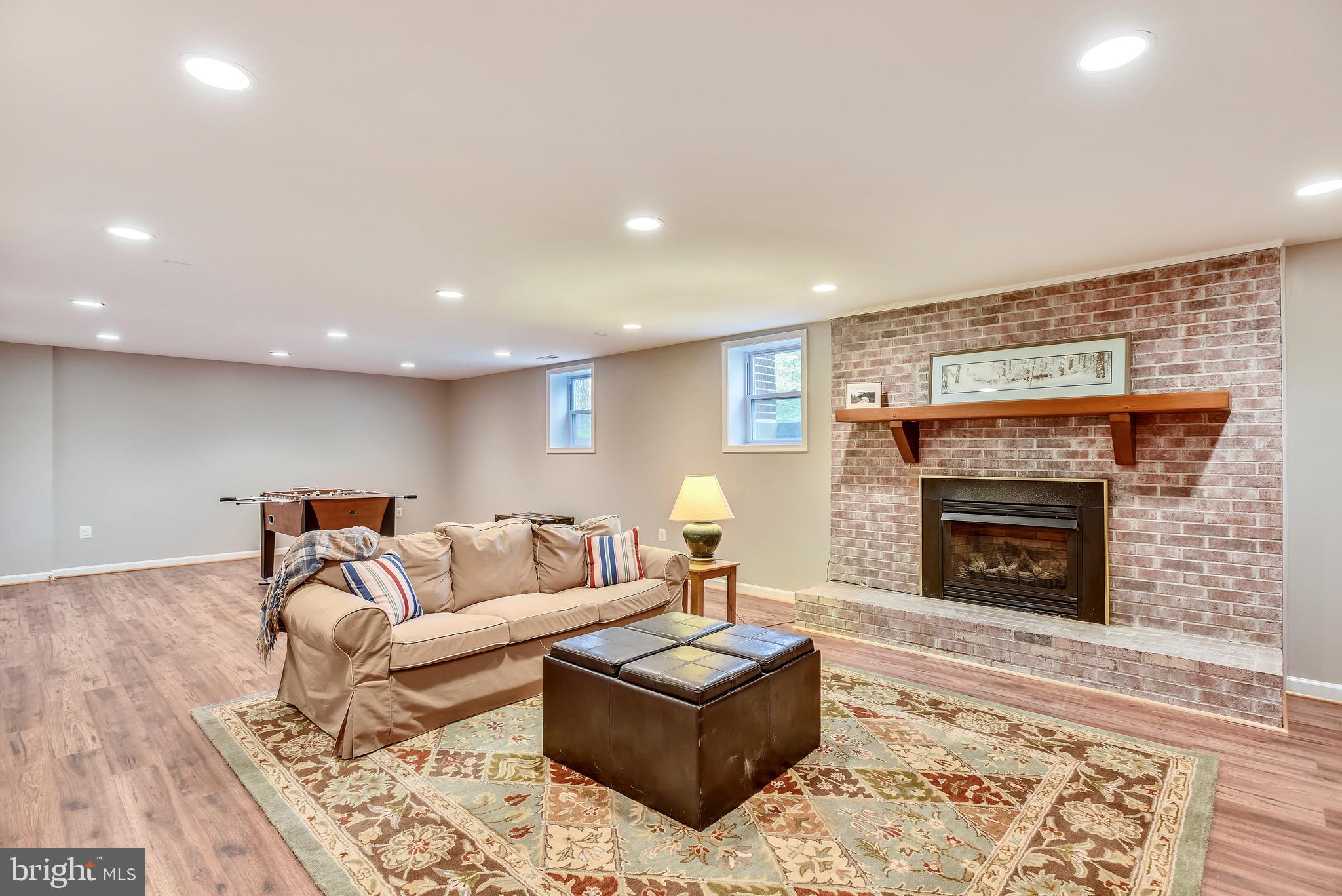 11727 Quay Road Oakton, VA 22124 - Photo 32 of 47 Huge rec room features warm gas fireplace