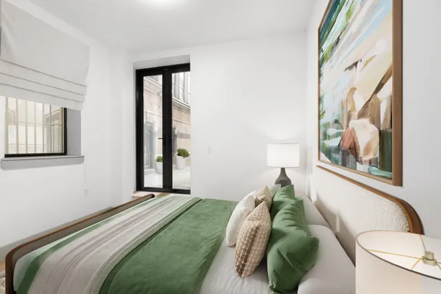 a living room with furniture and a dining table with kitchen view