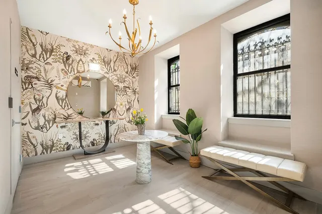 a living room with patio furniture and a window