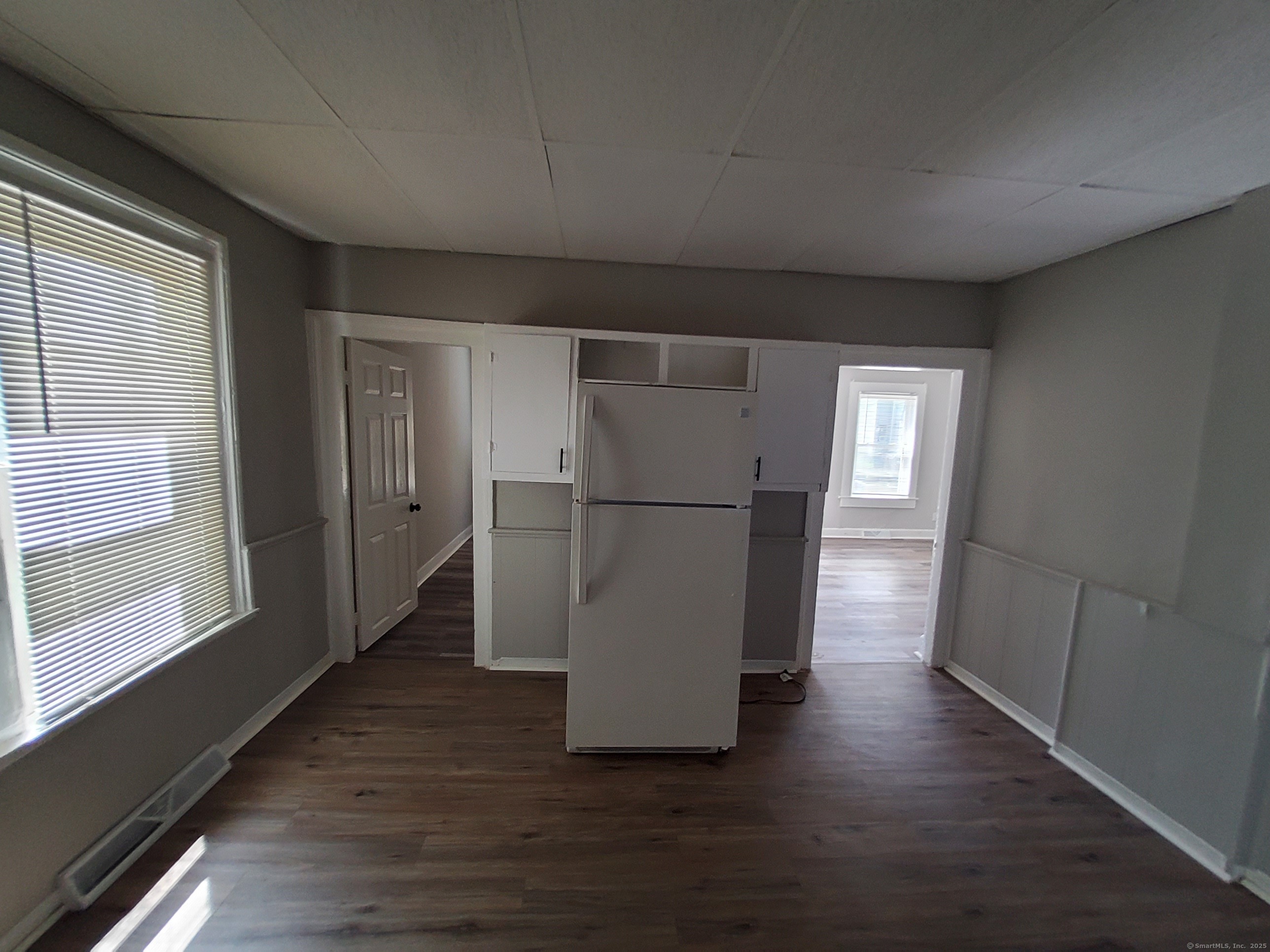 199 Saltonstall Avenue, Unit 1 New Haven, CT 06513 - Photo 9 of 12 a view of a hallway with wooden floor and a kitchen space