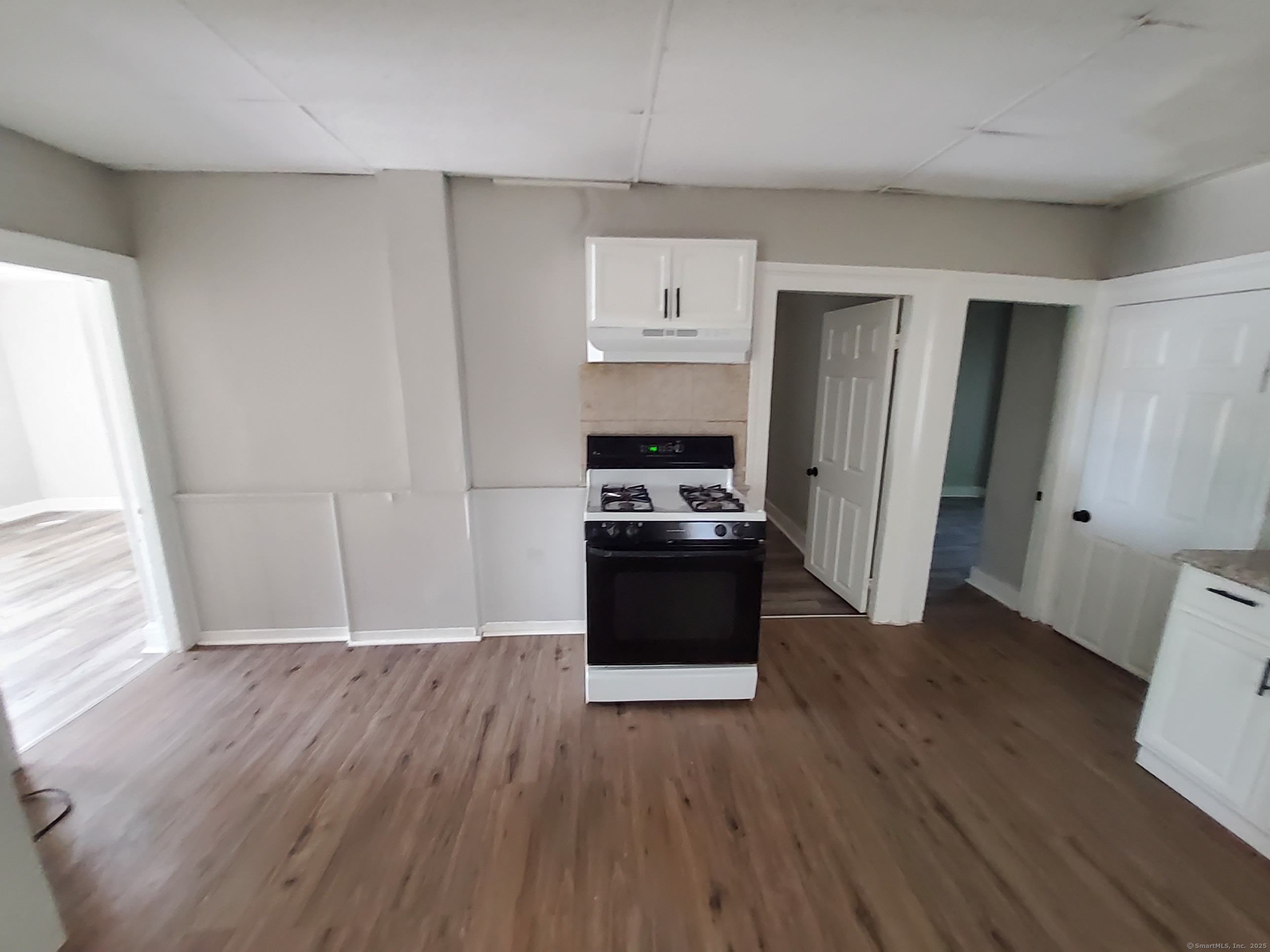 199 Saltonstall Avenue, Unit 1 New Haven, CT 06513 - Photo 10 of 12 a view of a refrigerator in kitchen and wooden floor