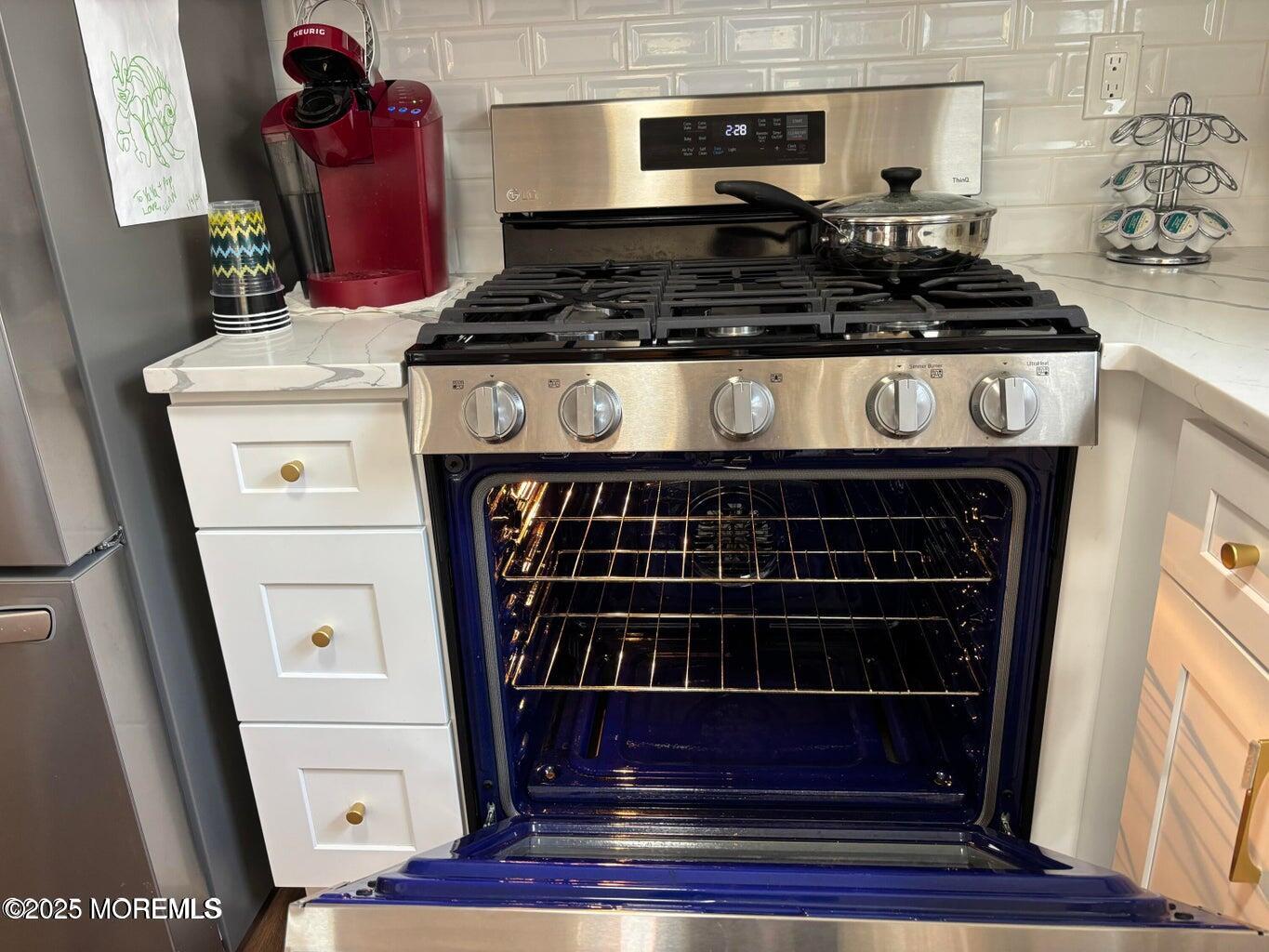 10 Whitman Street Brick, NJ 08724 - Photo 6 of 19 a stove top oven sitting inside of a kitchen