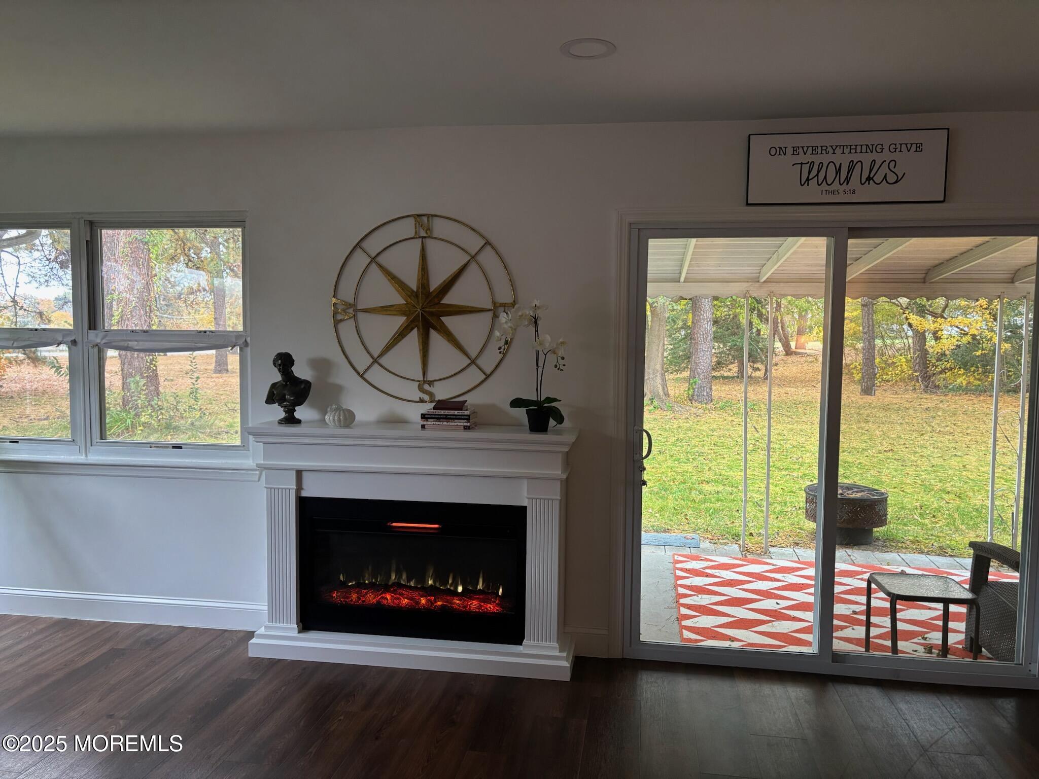 10 Whitman Street Brick, NJ 08724 - Photo 9 of 19 a living room with fireplace furniture and a large window