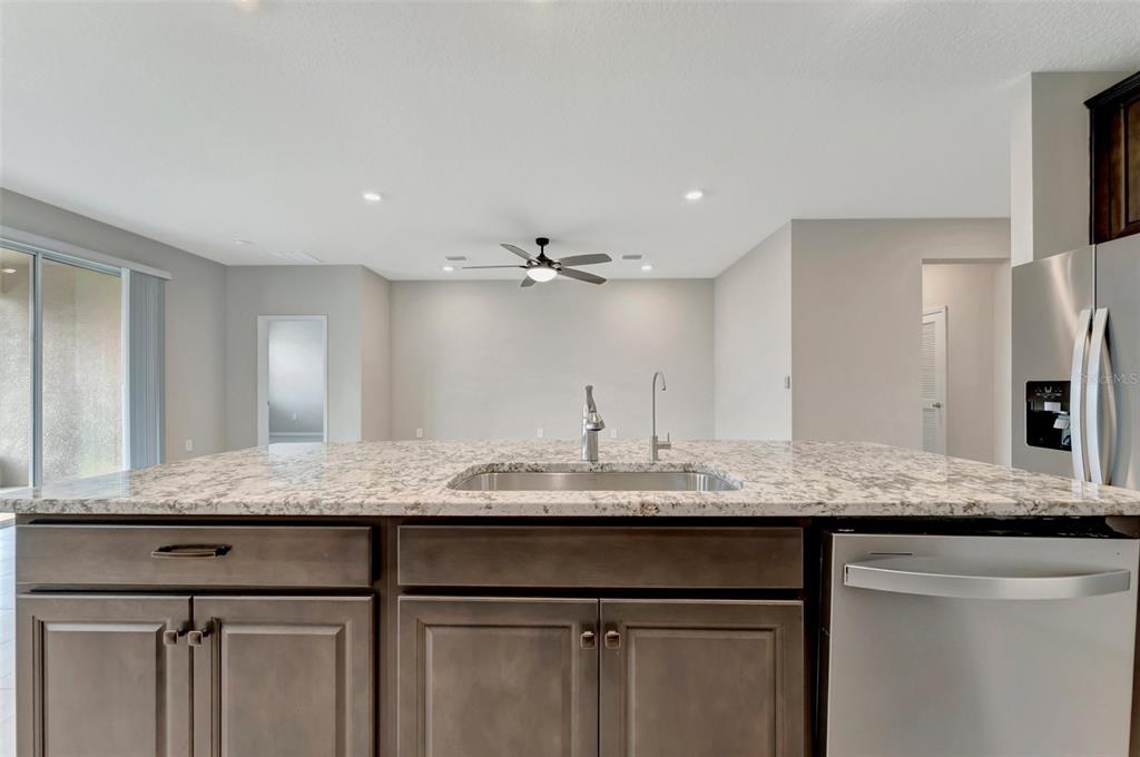 5210 Grove Mill Loop Lakewood Ranch, FL 34211 - Photo 13 of 48 a bathroom with a granite countertop sink and a mirror