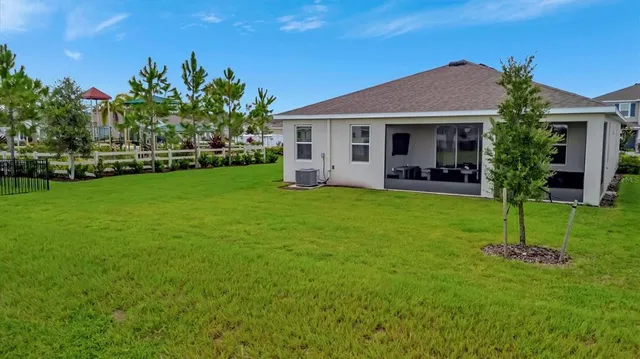a front view of a house with a garden and yard