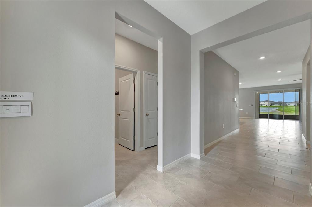 5210 Grove Mill Loop Lakewood Ranch, FL 34211 - Photo 29 of 48 a view of a hallway with wooden floor