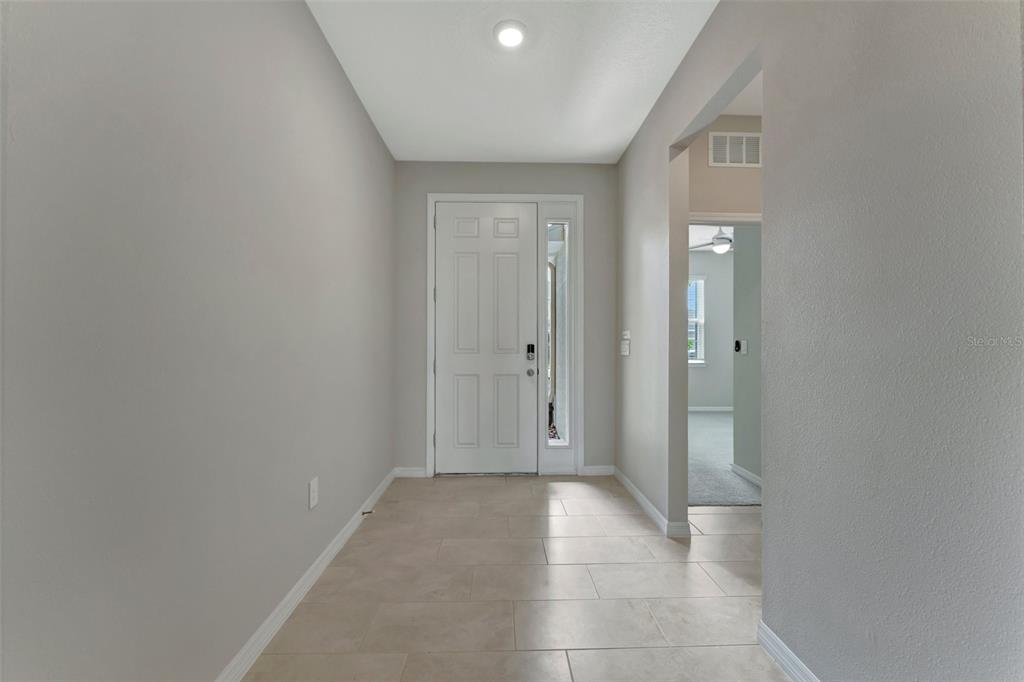 5210 Grove Mill Loop Lakewood Ranch, FL 34211 - Photo 30 of 48 a view of a hallway with wooden shelves