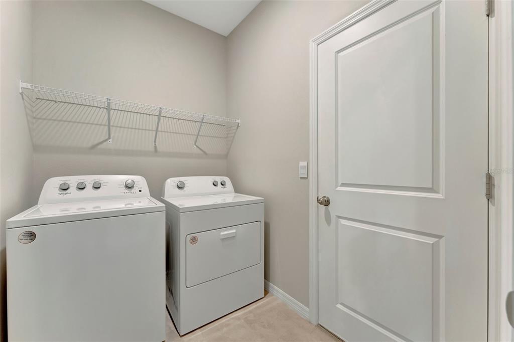 5210 Grove Mill Loop Lakewood Ranch, FL 34211 - Photo 32 of 48 a utility room with dryer and washer
