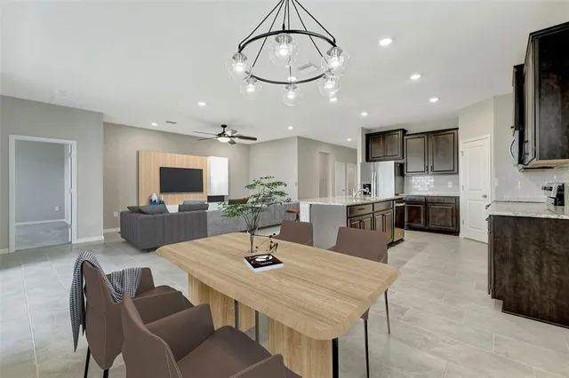 a kitchen with stainless steel appliances kitchen island granite countertop a sink and cabinets