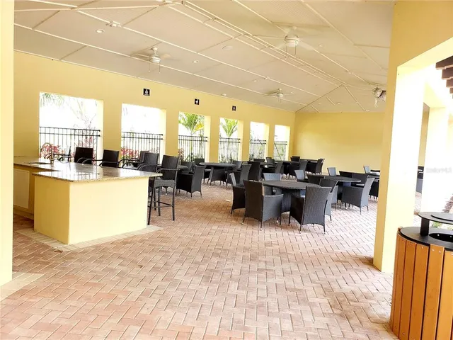 a living room with lots of furniture and a large window