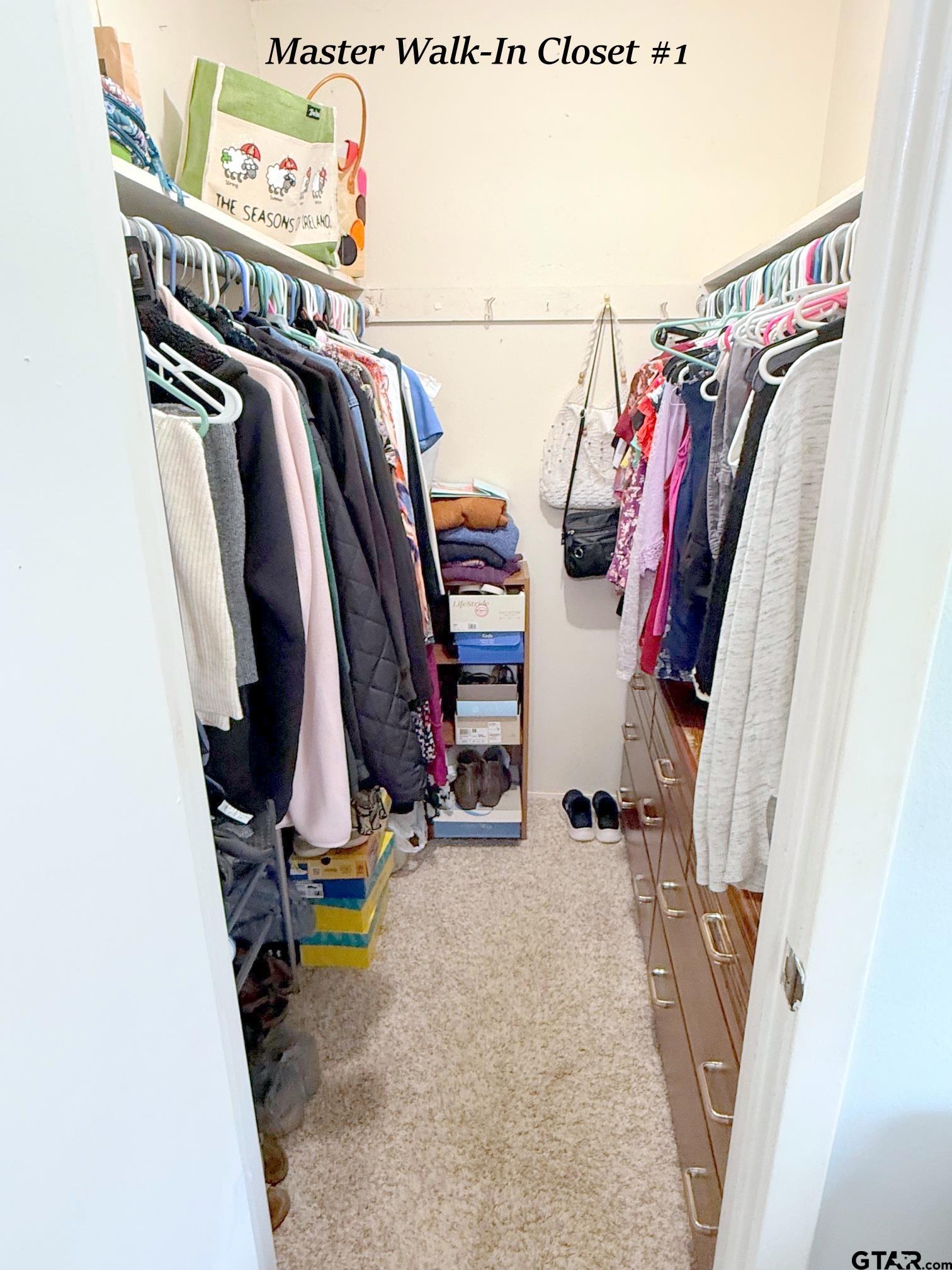 237 Oregon Street Van, TX 75790 - Photo 26 of 44 a view of walk in closet with clothes and shoes