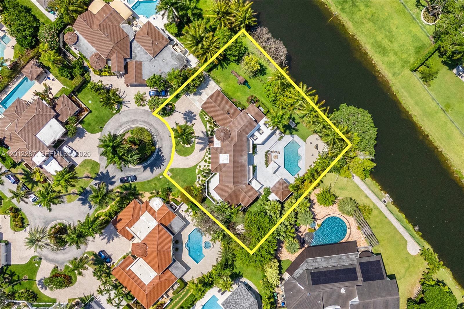 8763 Southwest 61st Place Pinecrest, FL 33156 - Photo 1 of 30 an aerial view of a house with a yard and swimming pool