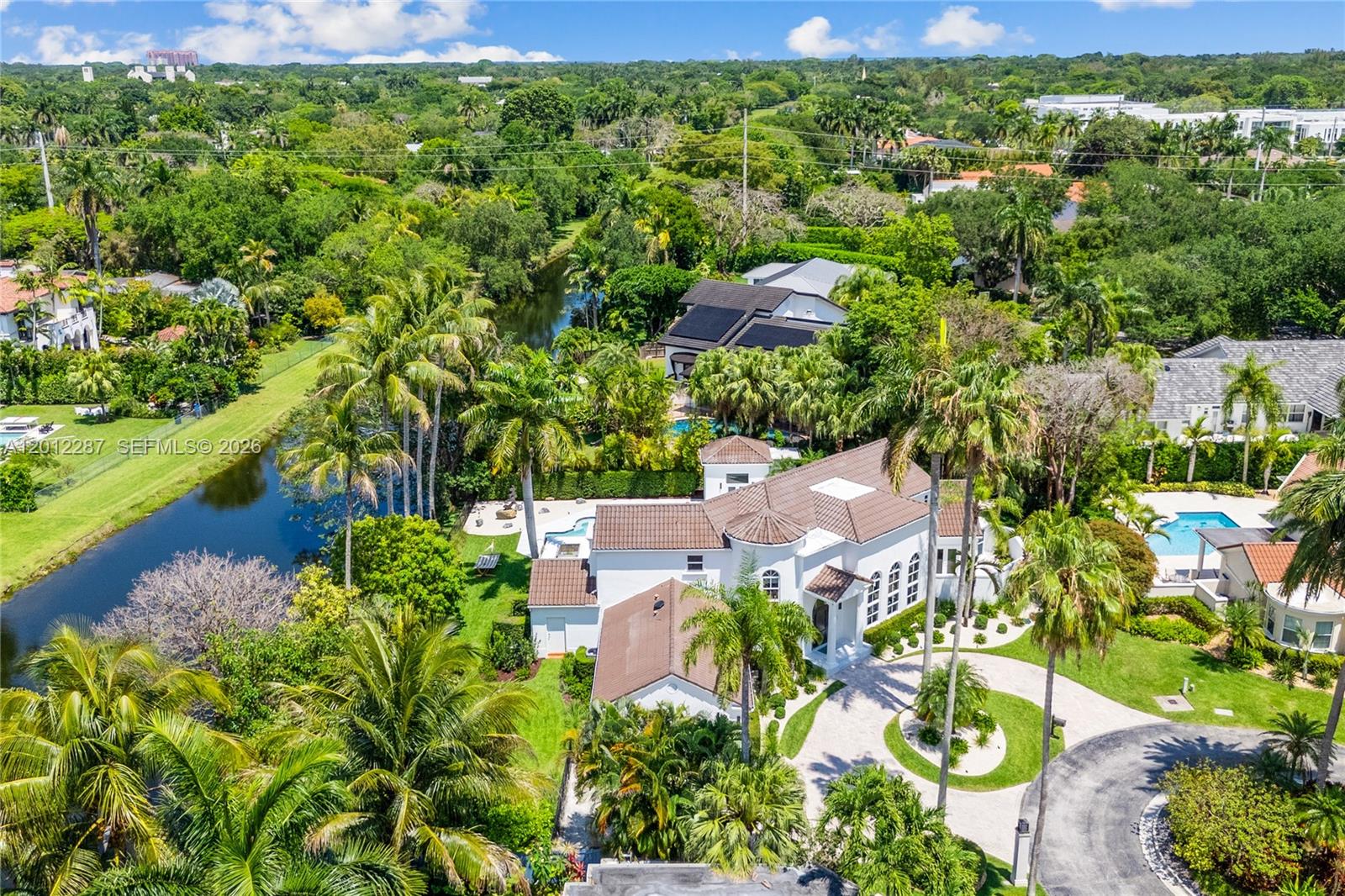 8763 Southwest 61st Place Pinecrest, FL 33156 - Photo 28 of 30 an aerial view of a house with a garden