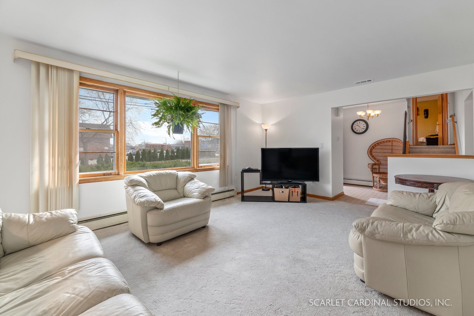 5018 Butterfield Road Hillside, IL 60162 - Photo 5 of 17 a living room with furniture and a flat screen tv