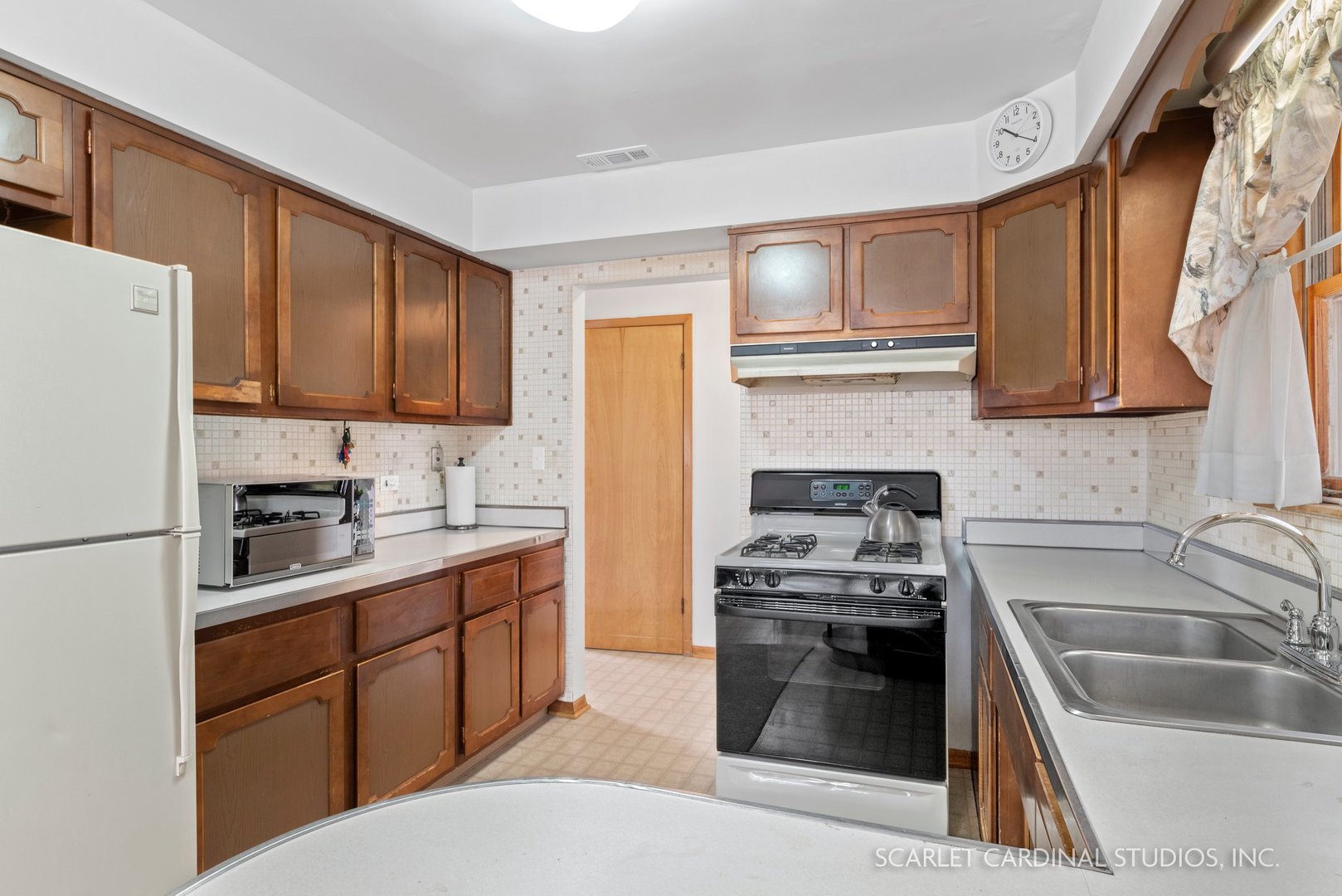 5018 Butterfield Road Hillside, IL 60162 - Photo 7 of 17 a kitchen with granite countertop a sink stove and refrigerator
