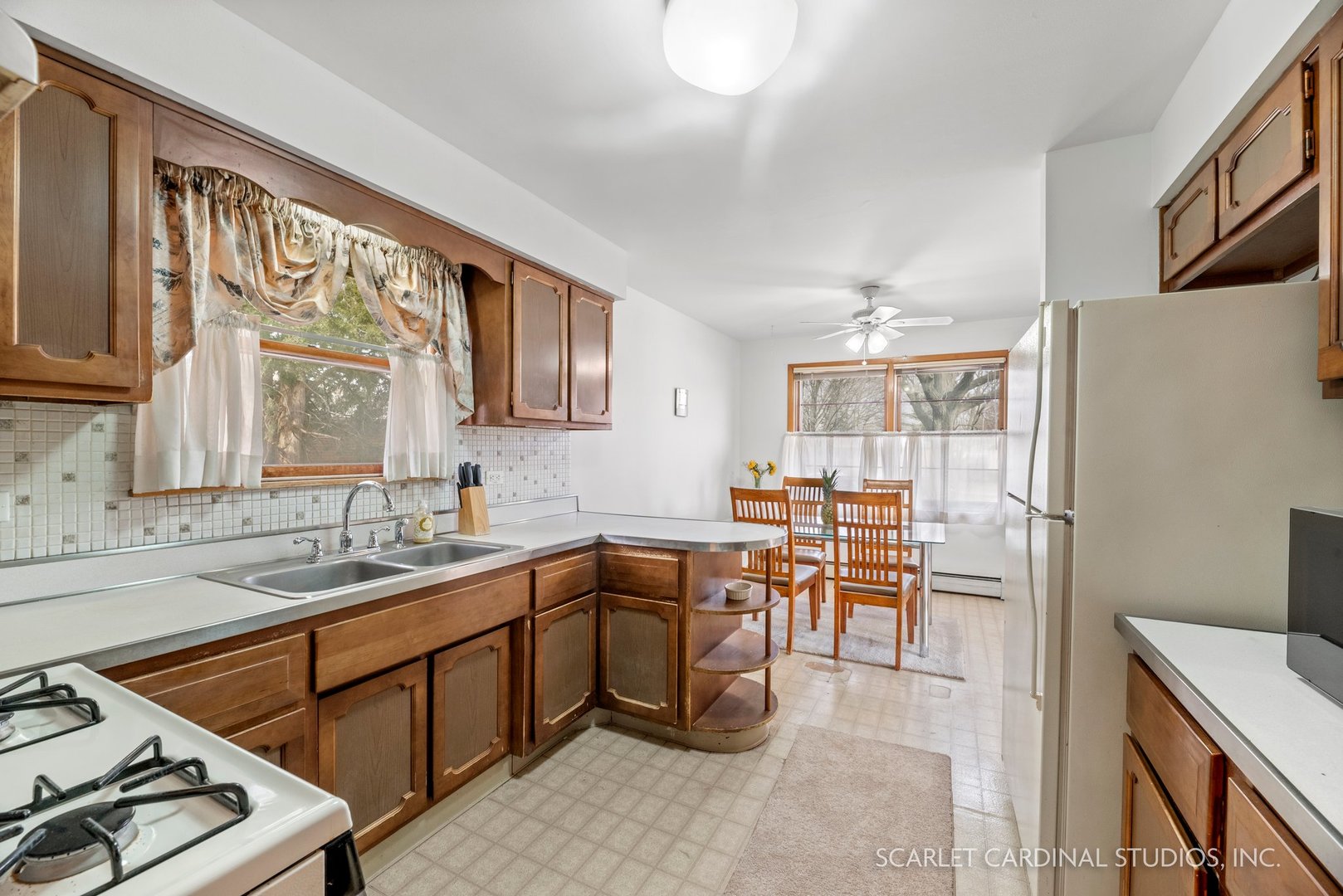 5018 Butterfield Road Hillside, IL 60162 - Photo 8 of 17 a kitchen with a sink stove and cabinets