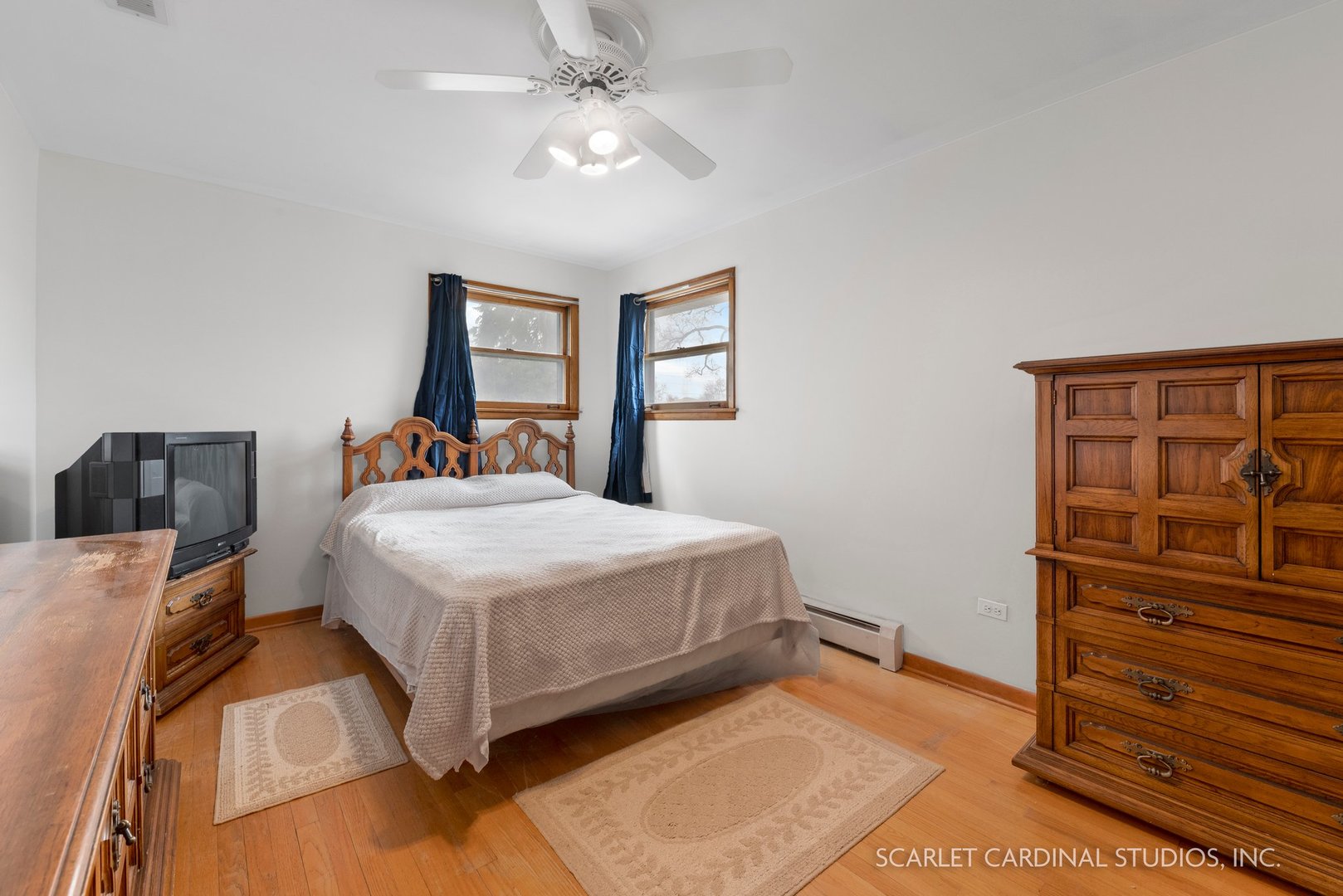 5018 Butterfield Road Hillside, IL 60162 - Photo 10 of 17 a bedroom with a bed and a dresser