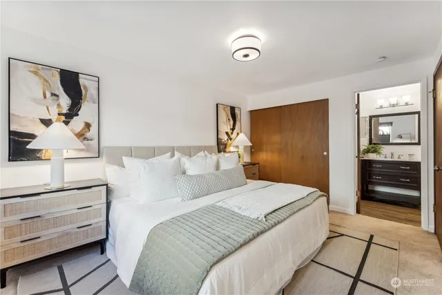 a bedroom with a bed and a dresser