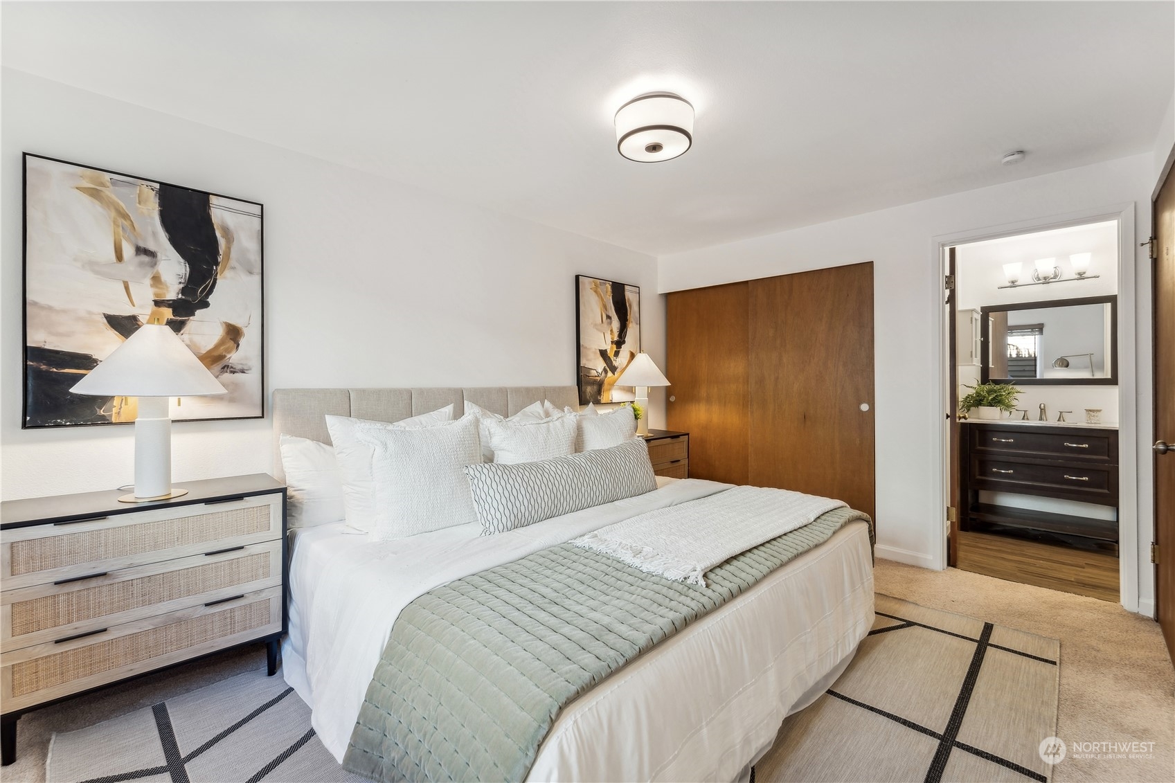 734 North 94th Street, Unit A3 Seattle, WA 98103 - Photo 16 of 20 a bedroom with a bed and a dresser