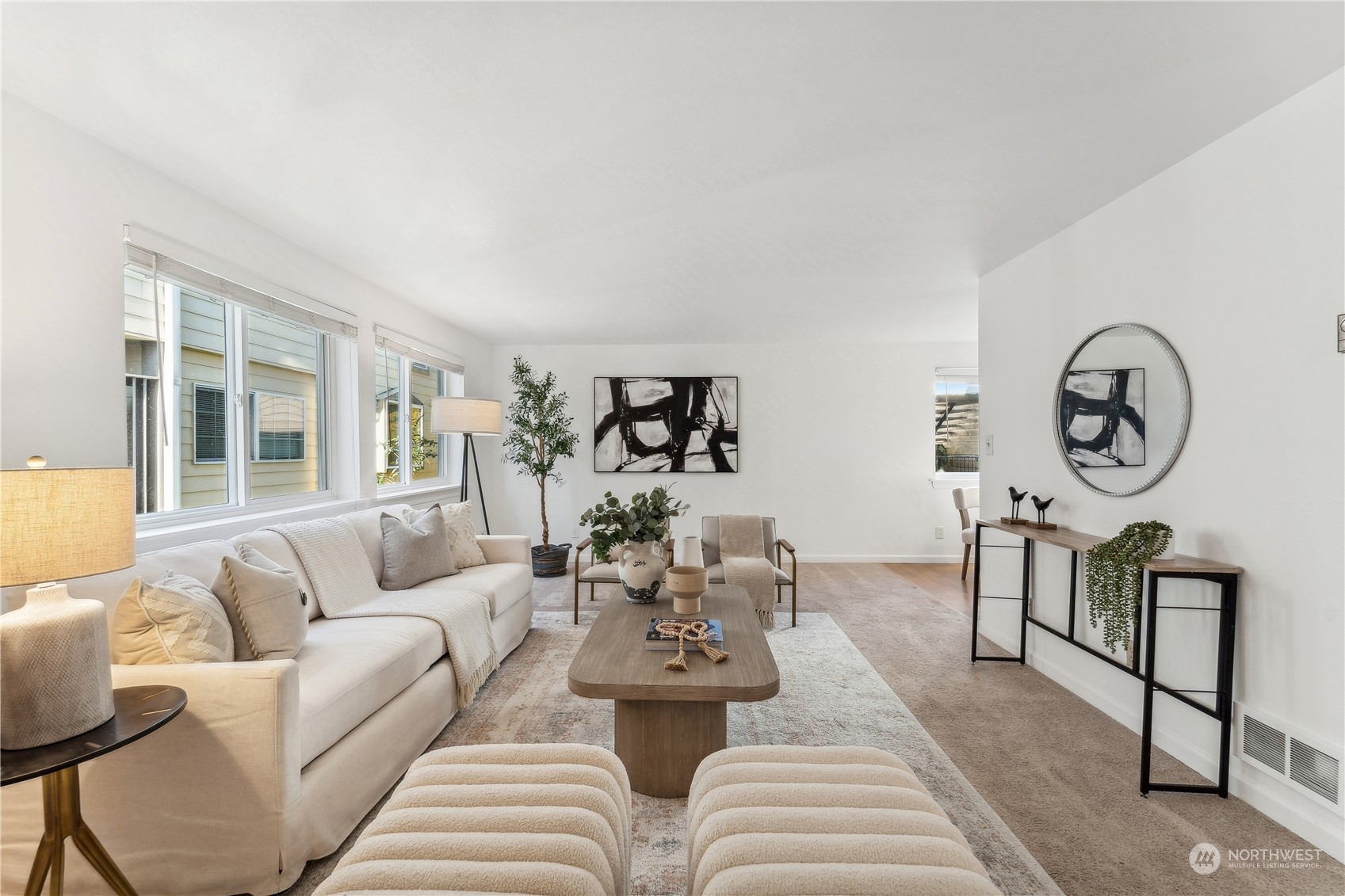734 North 94th Street, Unit A3 Seattle, WA 98103 - Photo 3 of 20 a living room with furniture a rug potted plant and a window