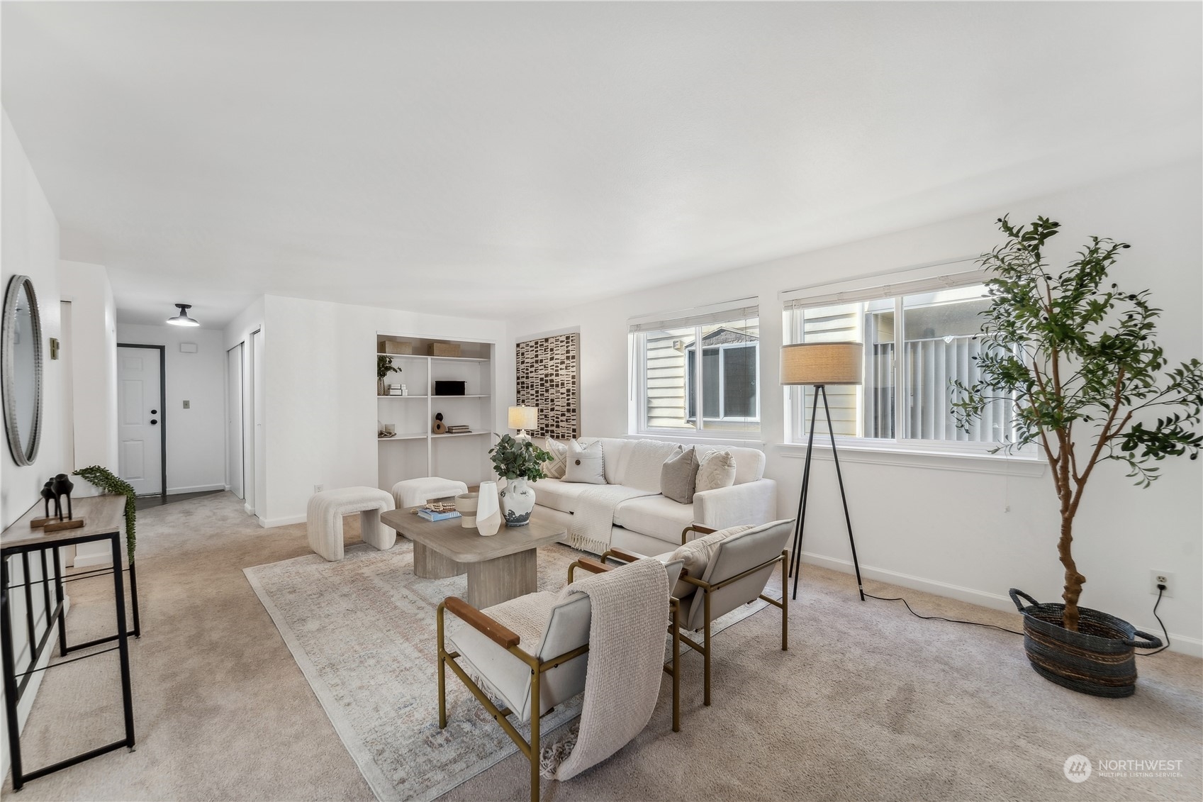 734 North 94th Street, Unit A3 Seattle, WA 98103 - Photo 4 of 20 a living room with furniture a window and potted plants