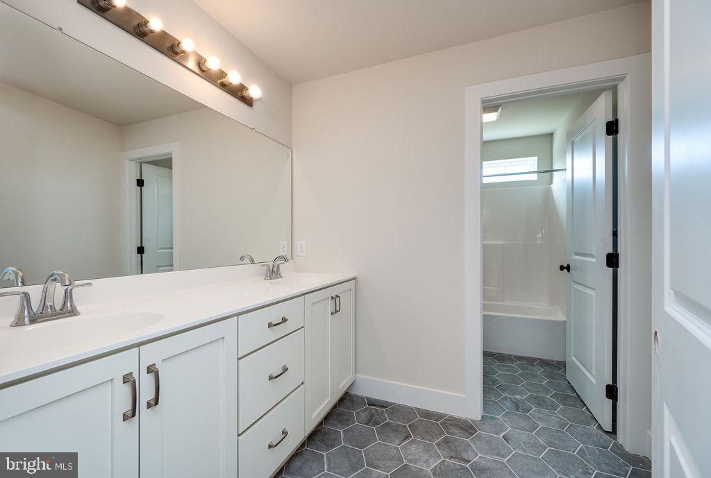 1053 Nemeth Road Coopersburg, PA 18036 - Photo 22 of 31 bathroom with double sink & private toilet/shower