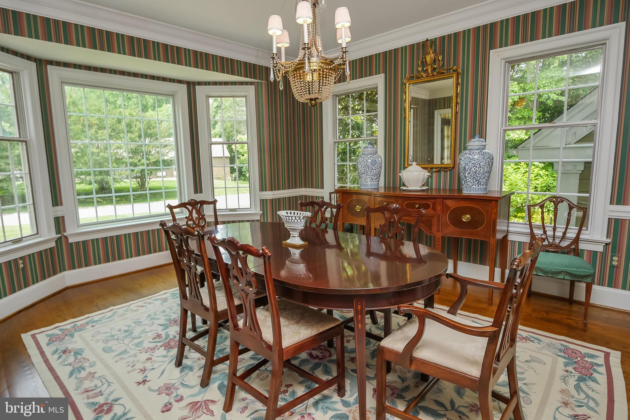 234 Pine Valley Road Dover, DE 19904 - Photo 16 of 48 a view of a dining room with furniture a chandelier and wooden floor