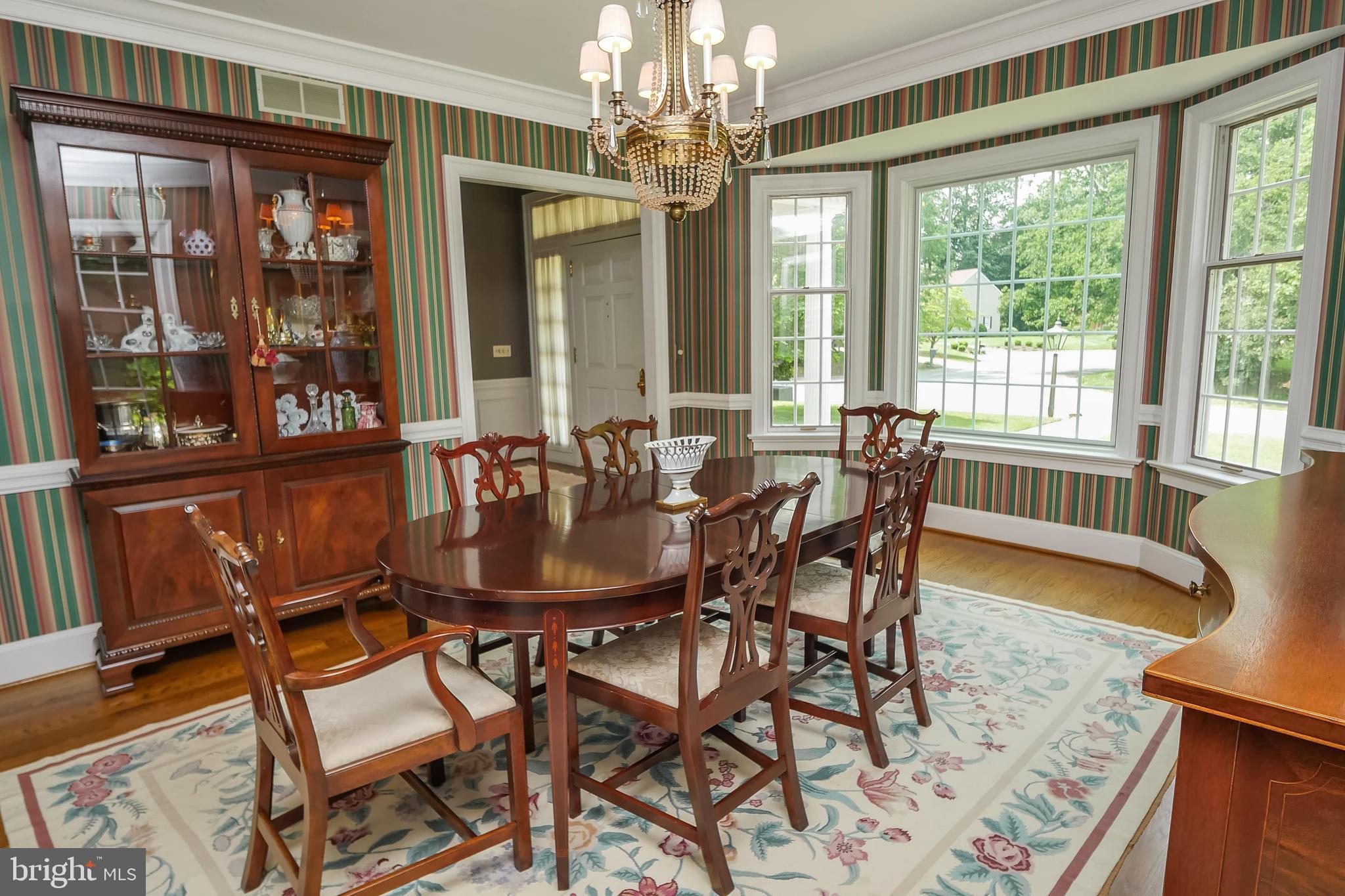 234 Pine Valley Road Dover, DE 19904 - Photo 17 of 48 a dining room with furniture a chandelier and wooden floor