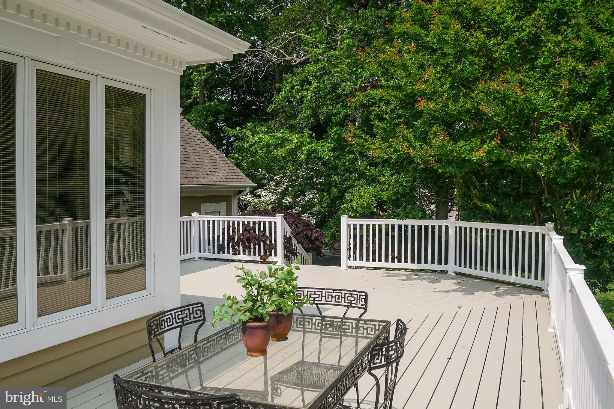 234 Pine Valley Road Dover, DE 19904 - Photo 42 of 48 a balcony with wooden floor table and chairs