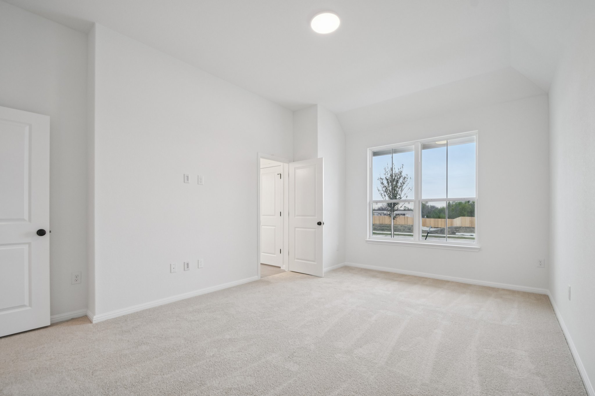 6385 Marsh Lane Buda, TX 78610 - Photo 14 of 35 a view of an empty room with a window