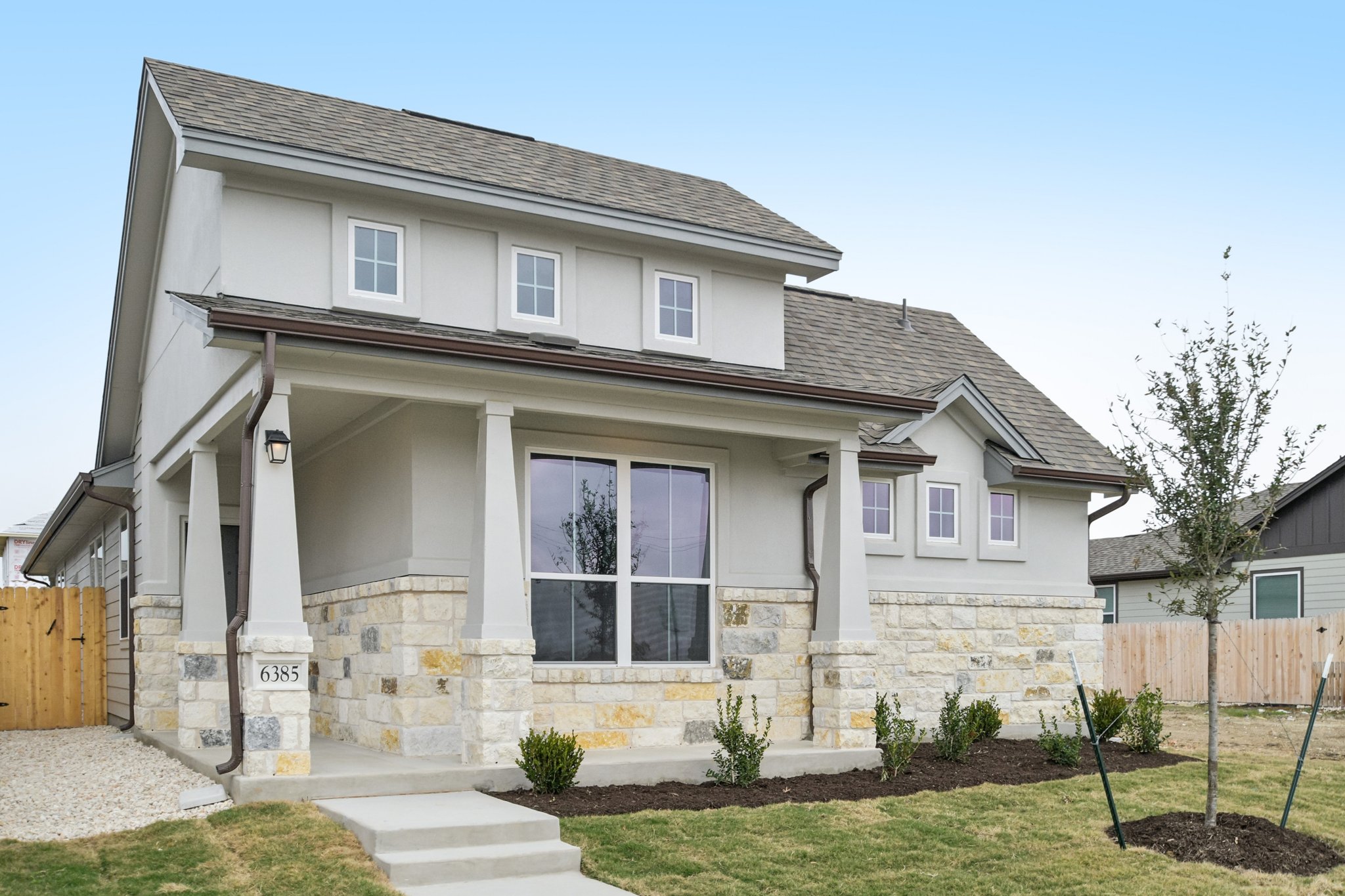 6385 Marsh Lane Buda, TX 78610 - Photo 2 of 35 a front view of a house with a yard