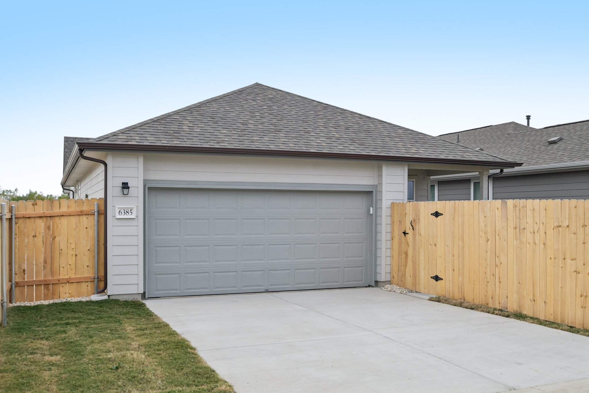 6385 Marsh Lane Buda, TX 78610 - Photo 25 of 35 a front view of a house with a garage