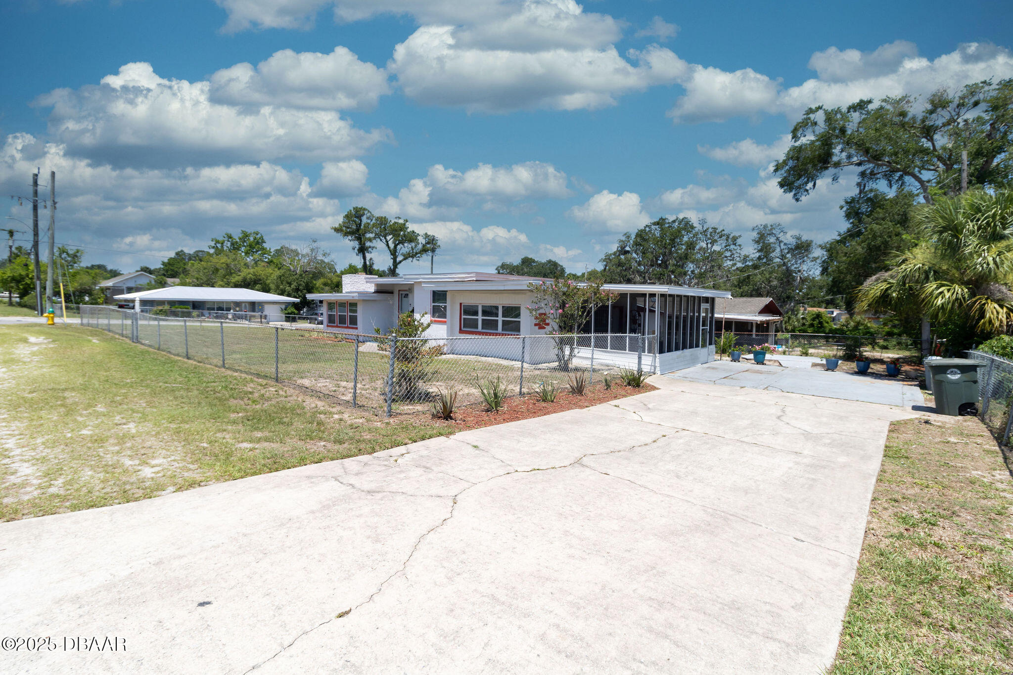 601 Berkshire Road Daytona Beach, FL 32114 - Photo 2 of 21 a view of a swimming pool with a patio