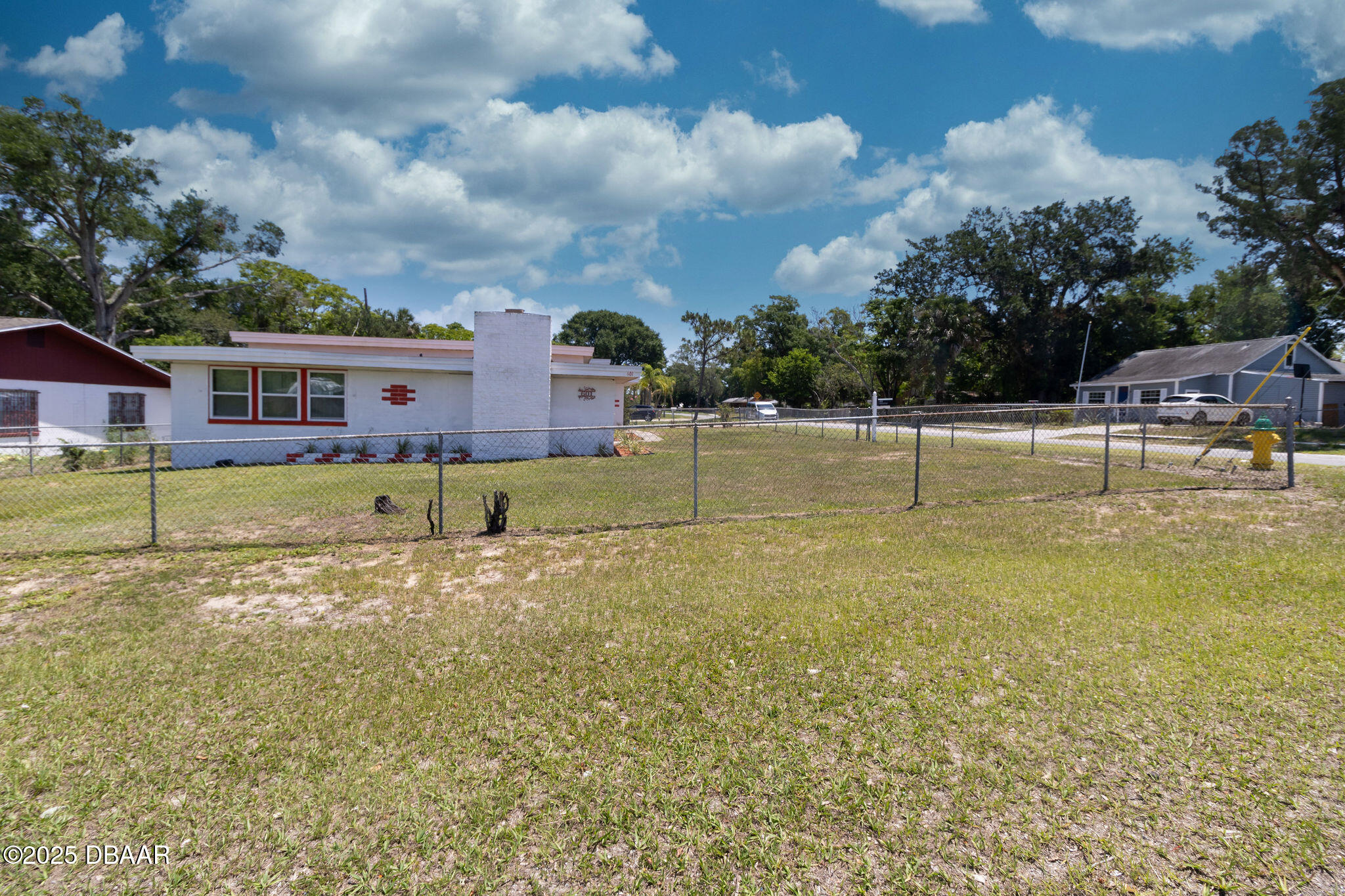 601 Berkshire Road Daytona Beach, FL 32114 - Photo 3 of 21 a view of a house with a yard