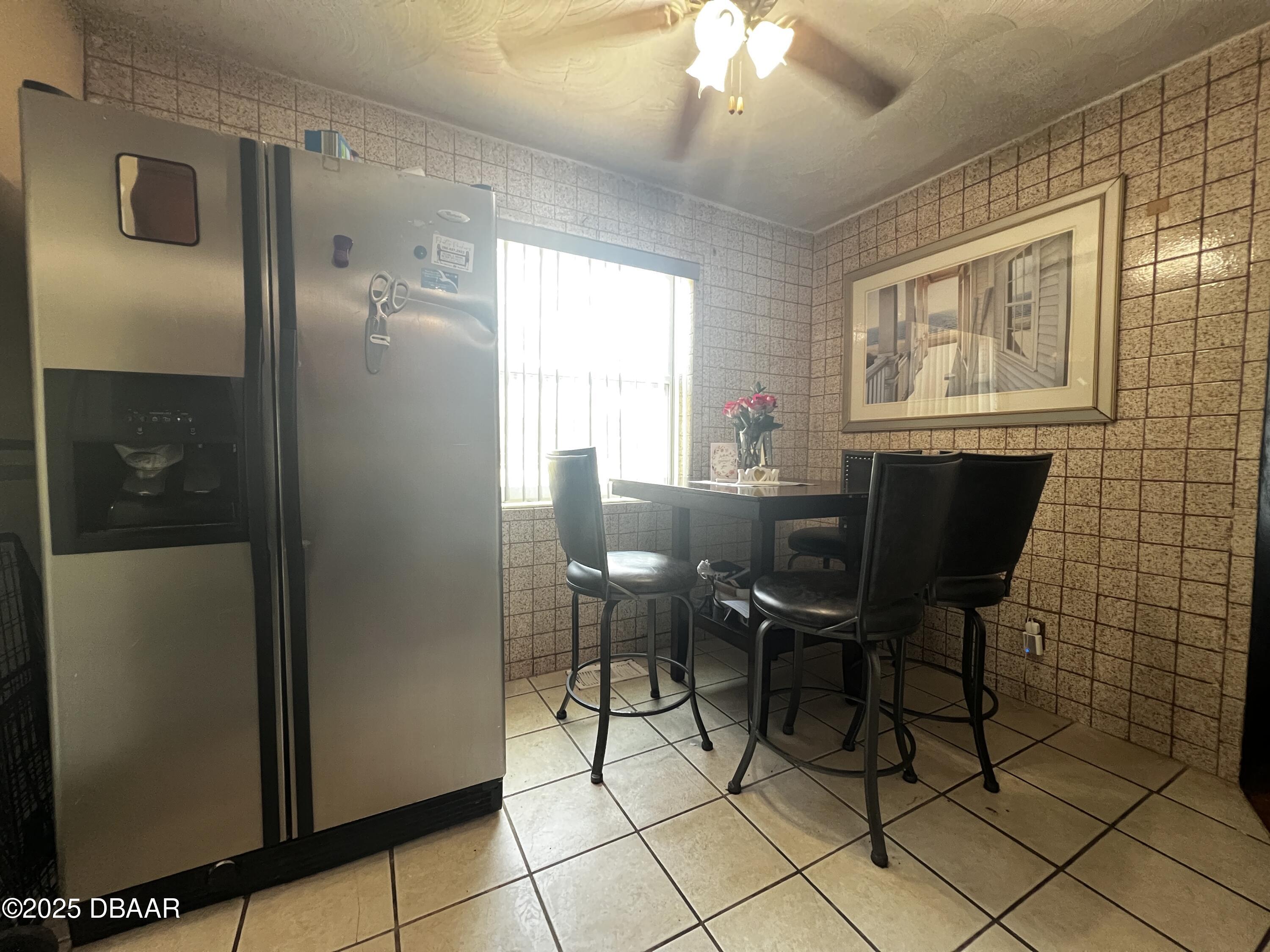 601 Berkshire Road Daytona Beach, FL 32114 - Photo 8 of 21 a view of a dining room with furniture and chandelier