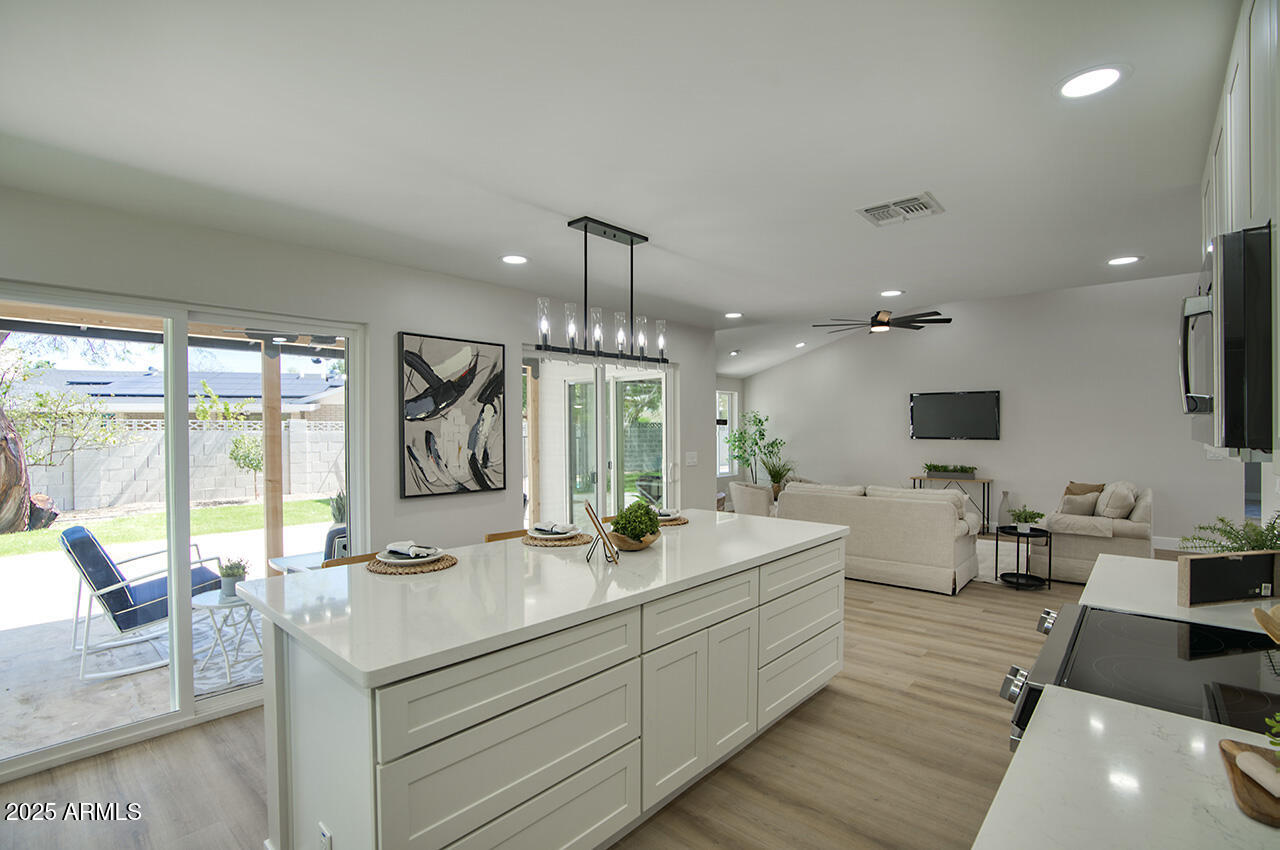 1561 North 26th Street Mesa, AZ 85213 - Photo 14 of 35 a bathroom with a double vanity sink and a large mirror
