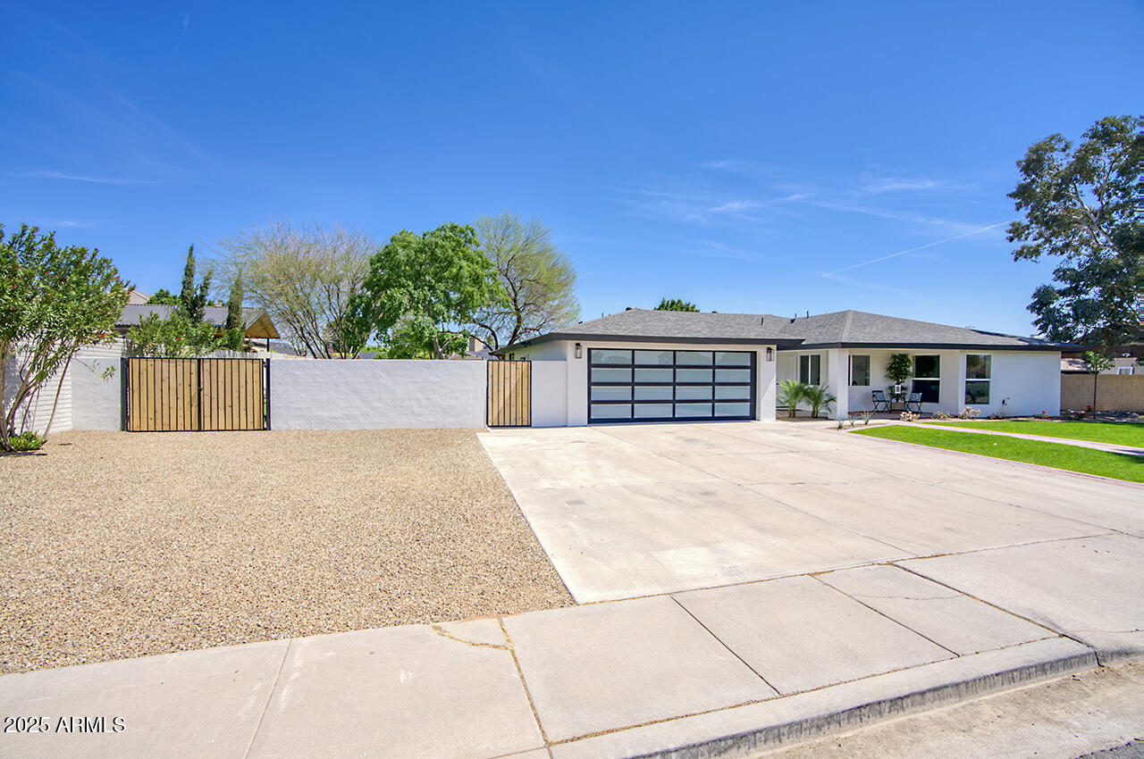 1561 North 26th Street Mesa, AZ 85213 - Photo 2 of 35 a view of swimming pool in front of house