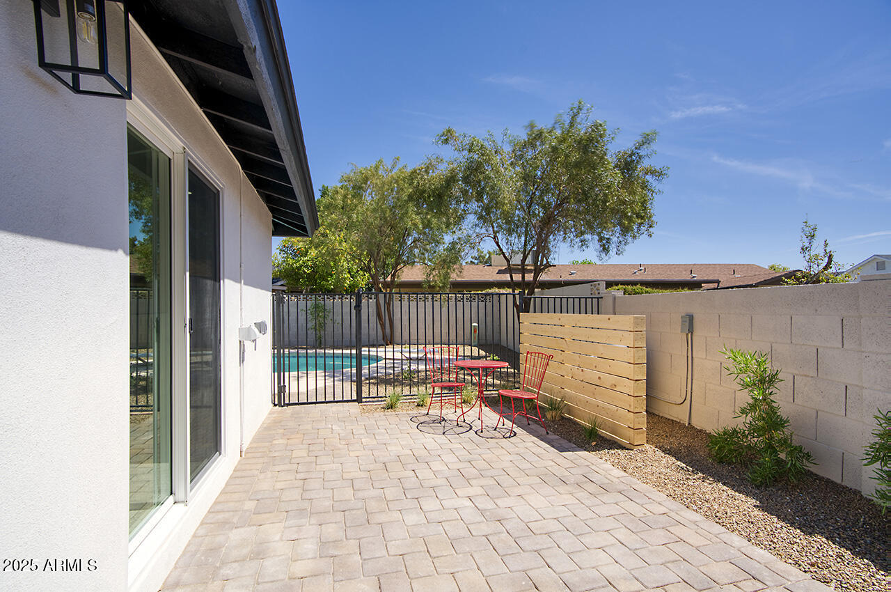 1561 North 26th Street Mesa, AZ 85213 - Photo 21 of 35 a house with trees in front of it