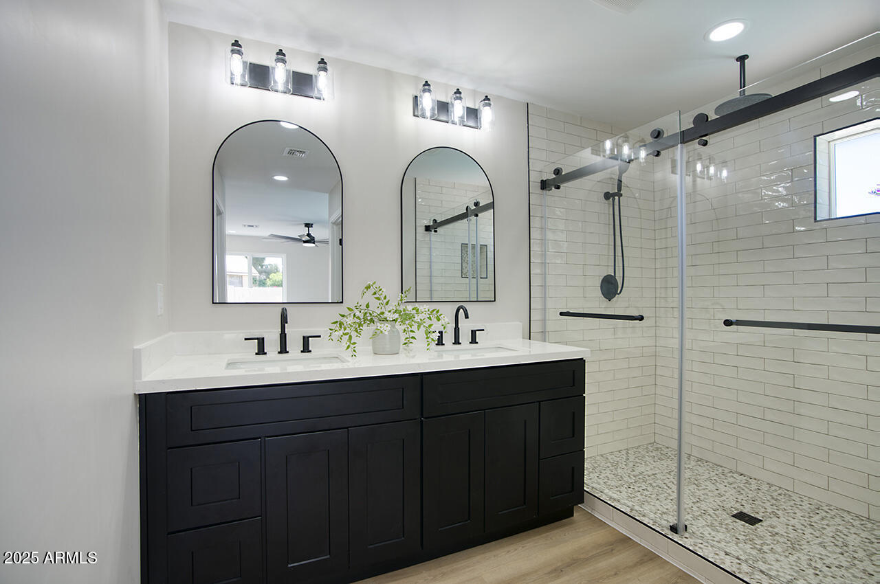 1561 North 26th Street Mesa, AZ 85213 - Photo 22 of 35 a bathroom with a double vanity sink mirror and shower